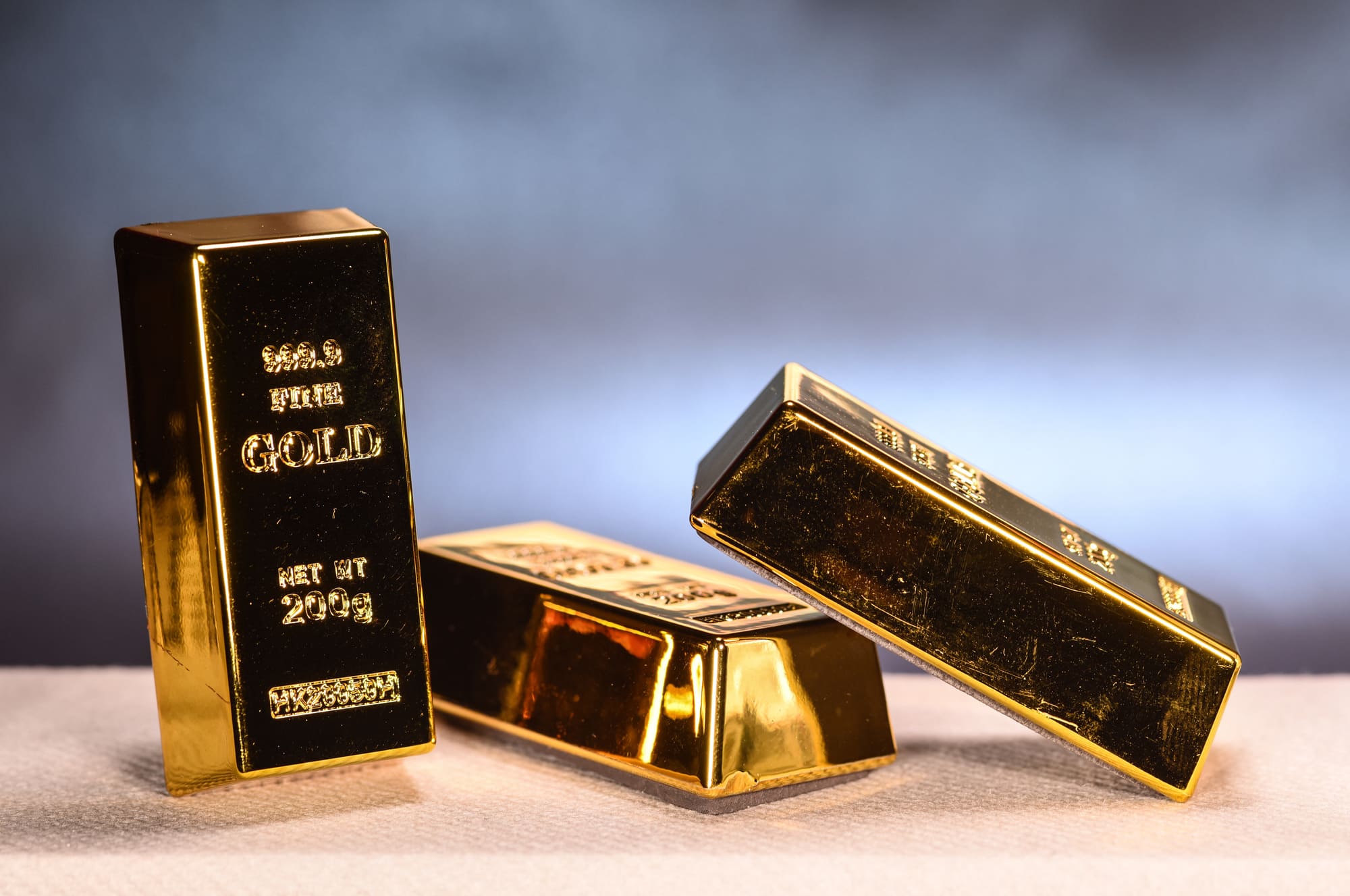 Lingots d’or pur illustrant la vente et le rachat de lingots d’or.